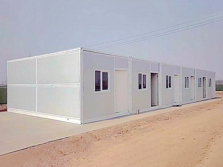 Folding shipping container with compact design for easy transport, storage, and quick modular housing solutions