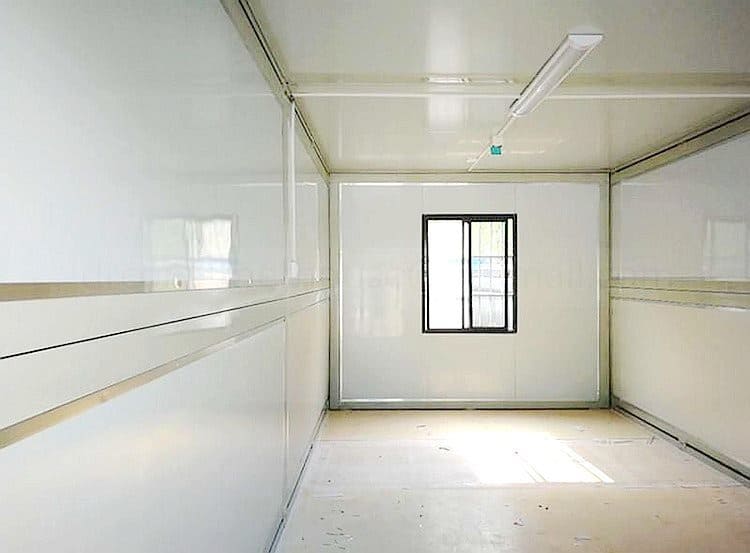 Folding shipping container with compact design for easy transport, storage, and quick modular housing solutions