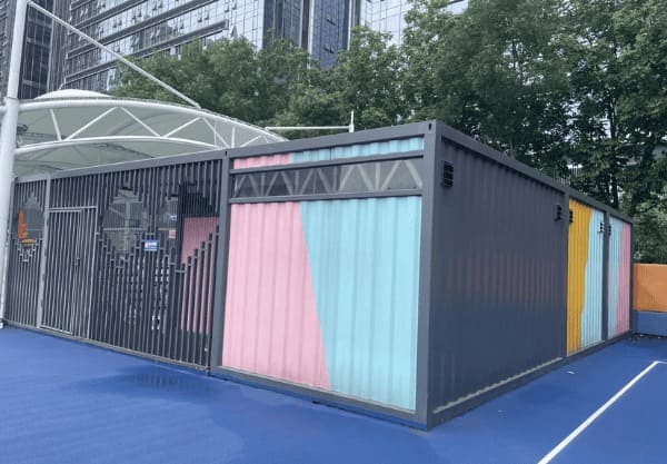 Portable shipping container changing room with durable steel structure and compact modular design for outdoor events and construction sites