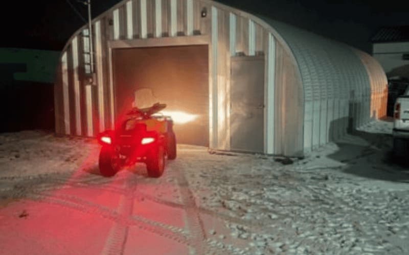 Durable steel garage with prefab metal structure, secure storage space, and low-maintenance design for cars, tools, and equipment.