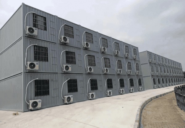 Modular container barracks with durable steel construction, designed for military, emergency, and temporary housing applications
