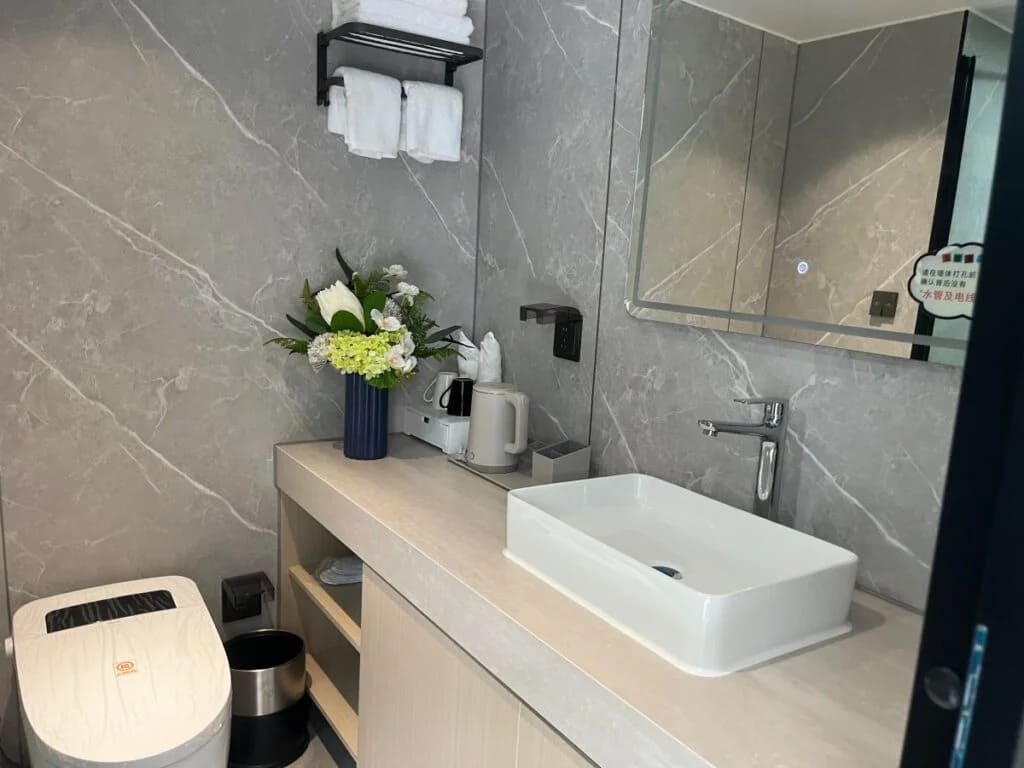 Compact capsule bathroom with modern modular design, space-saving layout, and high-quality finishes for residential and commercial use.