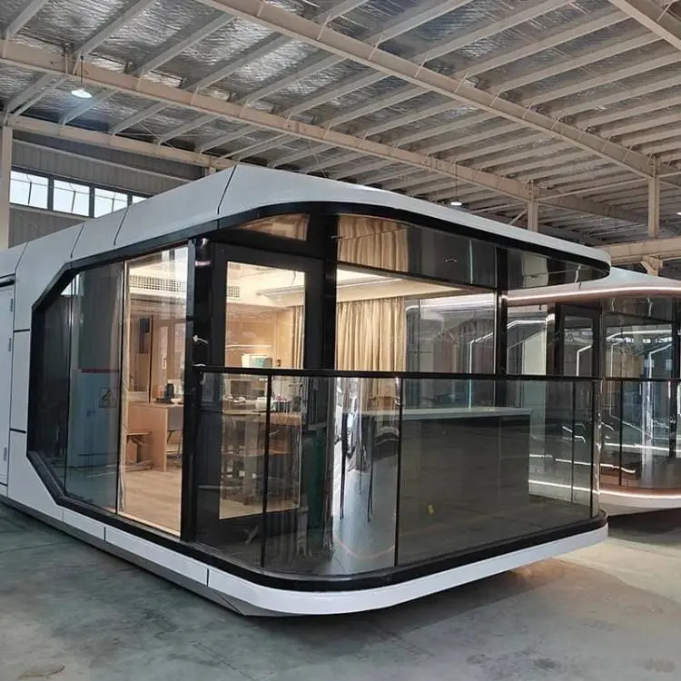 Space capsule modular prefab home with futuristic design, glass walls, and modern smart living interior.