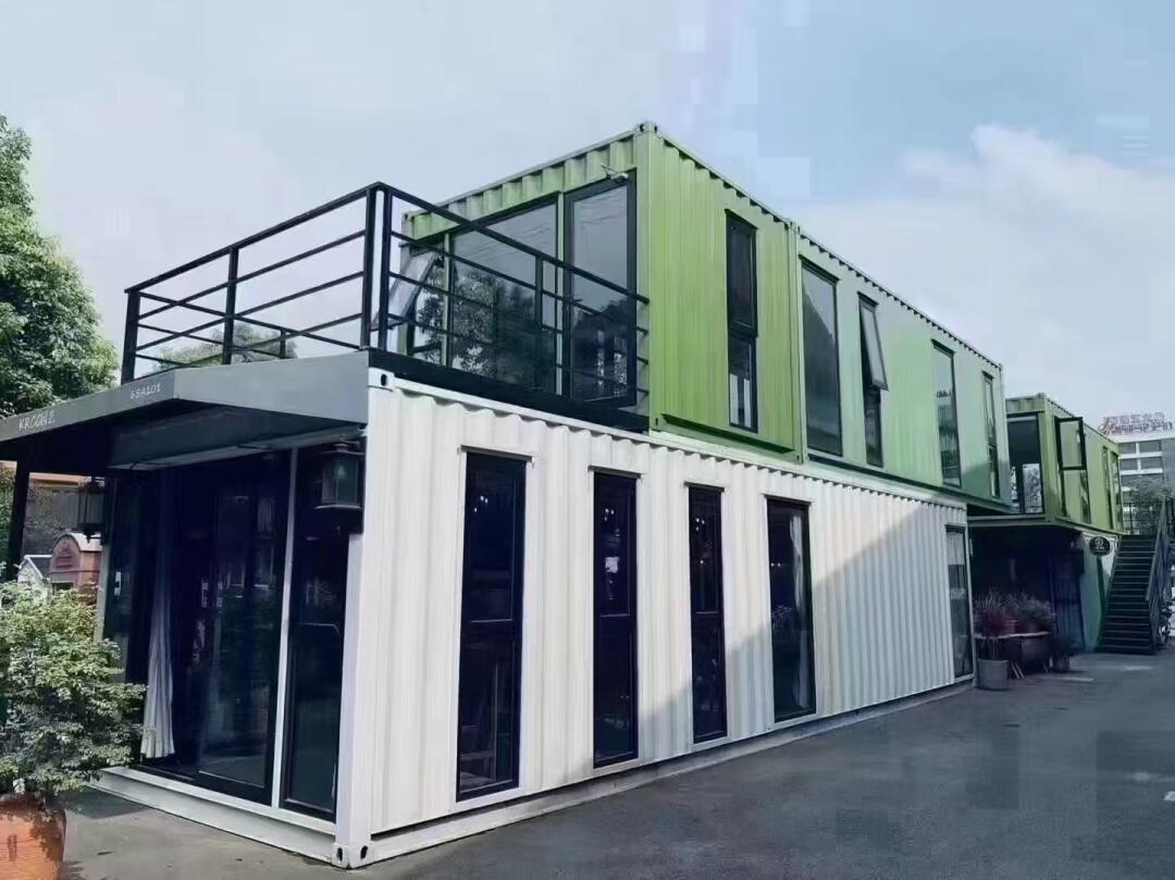 Modern container restaurant built from repurposed shipping containers, featuring outdoor seating and industrial design.