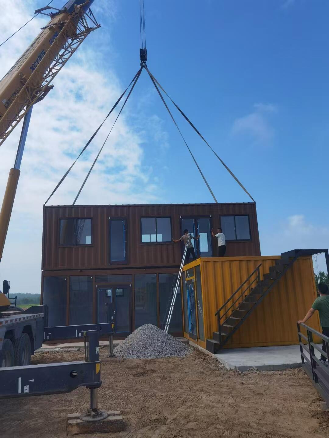 Modern container restaurant built from repurposed shipping containers, featuring outdoor seating and industrial design.