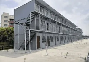 Modular container barracks with durable steel construction, designed for military, emergency, and temporary housing applications