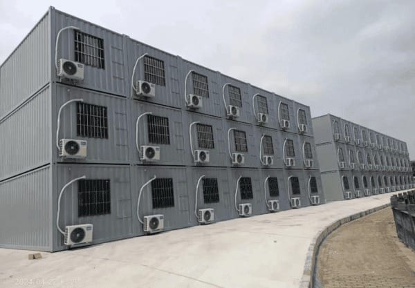 Modular container barracks with durable steel construction, designed for military, emergency, and temporary housing applications