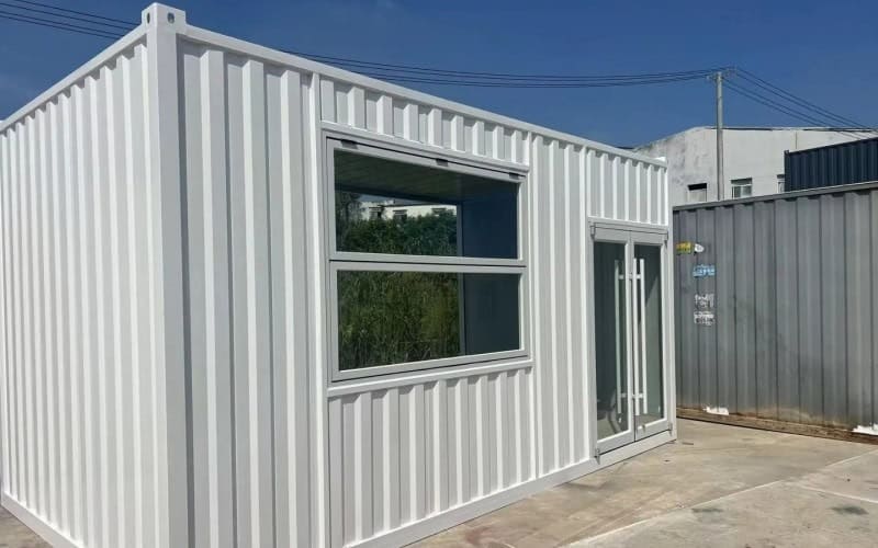 rendy shipping container bar with modern industrial design, outdoor seating, and eco-friendly modular construction for nightlife and events.