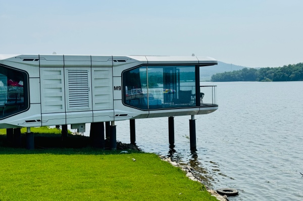 Modern space capsule house with futuristic modular design and smart living features for eco-friendly housing