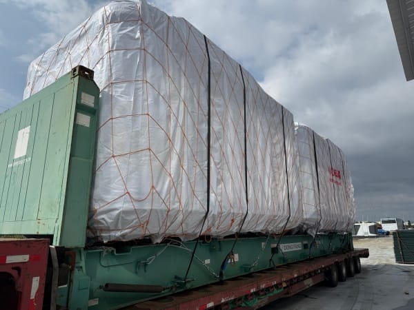 Space capsule house being transported on a flatbed truck, showcasing modular design and easy relocation for modern housing